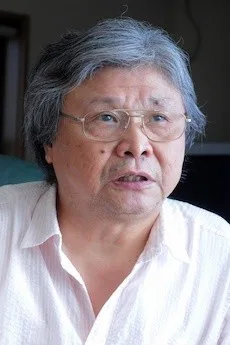 梁石日