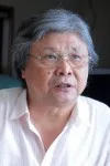 梁石日